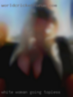 White woman going topless.